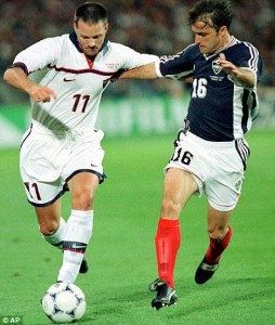 Eric Wynalda takes on Yugoslavia's Zeljko Petrovic