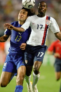 Beasley battles Italy's Allessandro Nesta