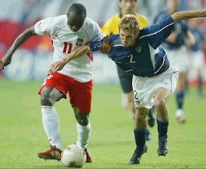 Frankie Hejduk battles Poland's Emmanuel Olisadebe