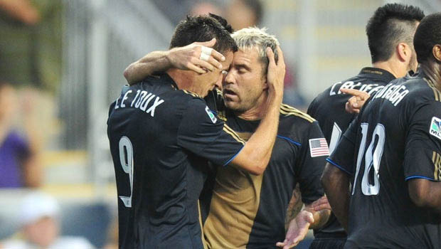 Eduardo Coudet celebrates with Le Toux