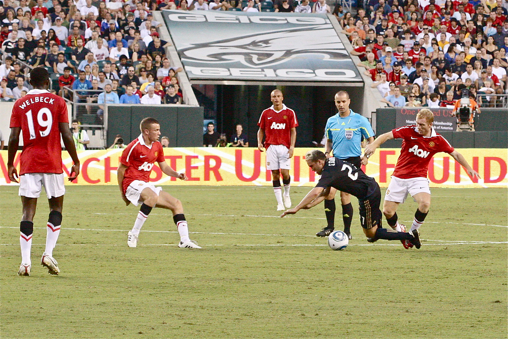 Eduardo Coudet goes down against Manchester United
