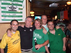 Friends (l-r) Stanislaw Guzikowski, Gary "Swing" McDonald, Joe Falloon, and John MaCrae pose with an unamed Celtic fan who disappeared into the lost canyons of the night.