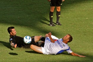 Danny Califf goes in with a heavy slide tackle