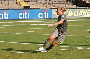Amy Rodriguez watches her game winning goal hit the net.
