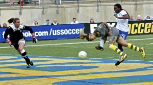 Tasha Kai heads the ball into the goal.