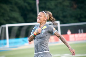 Tasha Kai celebrates another goal earning her a hat trick on the evening.