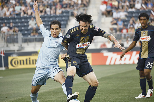 Danny Califf defends against KC