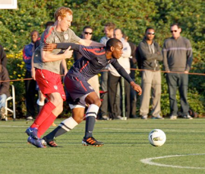 Okugo fends off Larentowicz