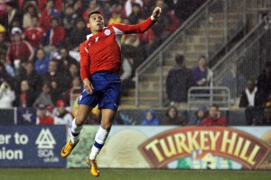 Alexis Sanchez goes up for a Header