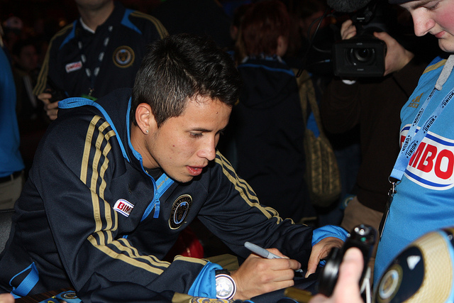 Roger Torres signing for a fan
