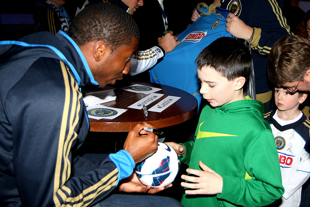 Raymon Gaddis signs a ball