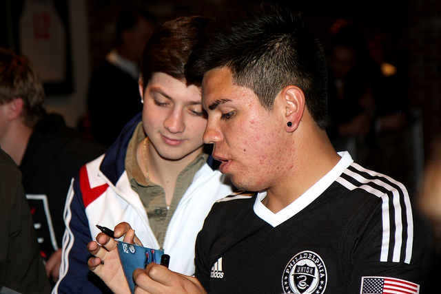 Chrithian Hernandez giving out cards