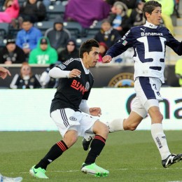 Michael Farfan watches his shot hit the back of the net
