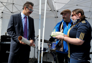 Danny Califf sports his best fake mustache and glasses while accepting a birthday cake from Union fans. (Photo: Earl Gardner)