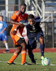 Darius Madison fights for space against Ocean City. (Photo Credit: Tom Boland)